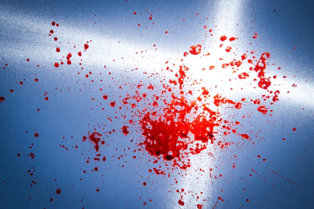 fake blood on a light defuser with the sun behind